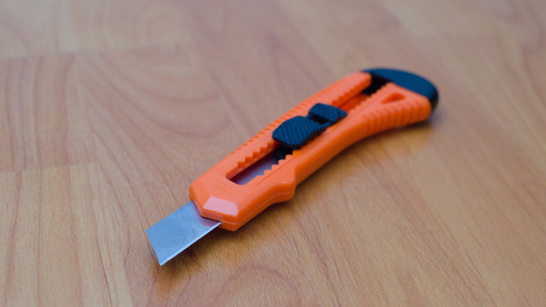 utility knife on laminate floor