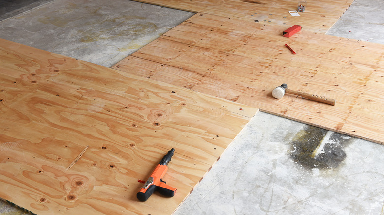 plywood panels over concrete subfloor