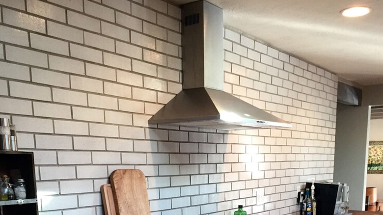 Subway tile running to ceiling