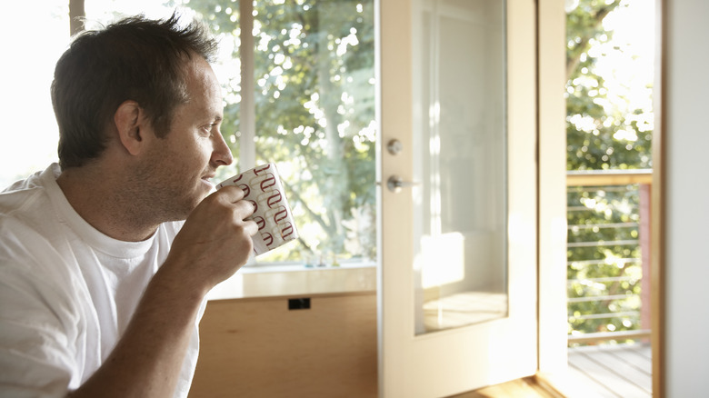 man enjoying open home windows