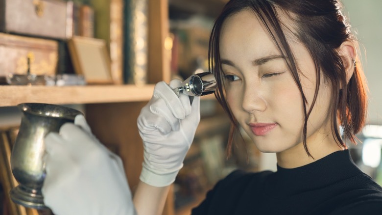 Woman doing antique appraisal 