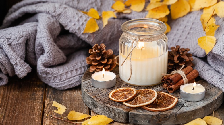 Candle burning on wood deck