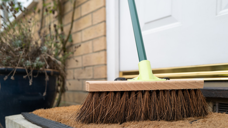 Broom with handle on porch 