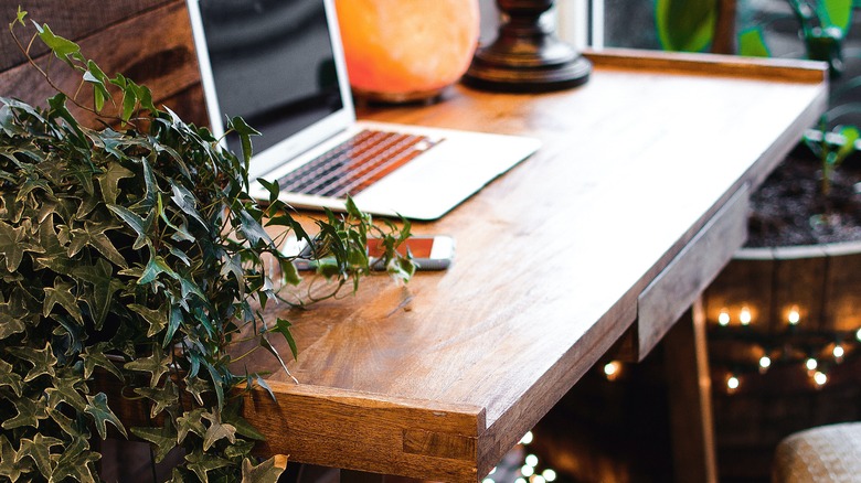 desk with lamp and laptop