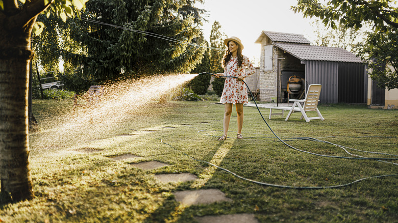 woman watering lawn