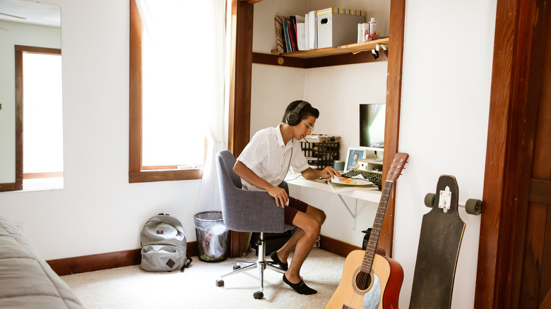 Child sitting at closet desk