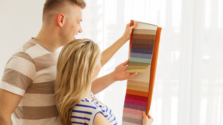 couple looking at colored materials