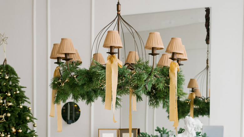 chandelier decorated with evergreens 