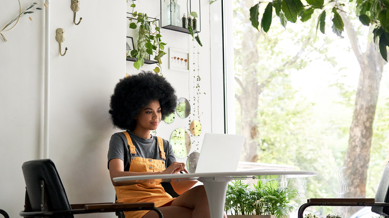 woman typing on laptop