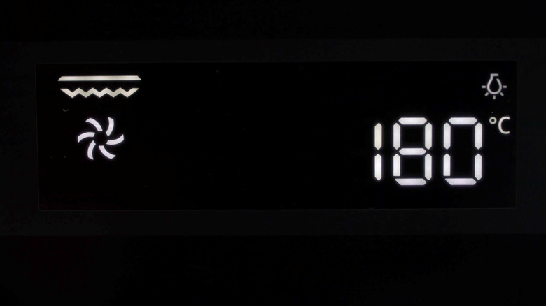 Fan grill function with numbers displayed on the LCD of a black oven