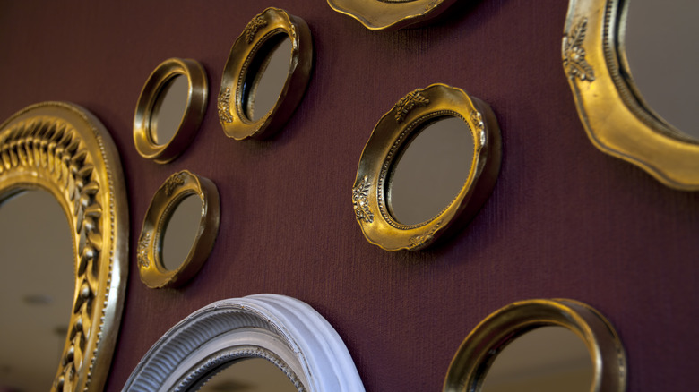 gold mirrors on wall