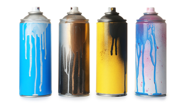 four cans of spray paint