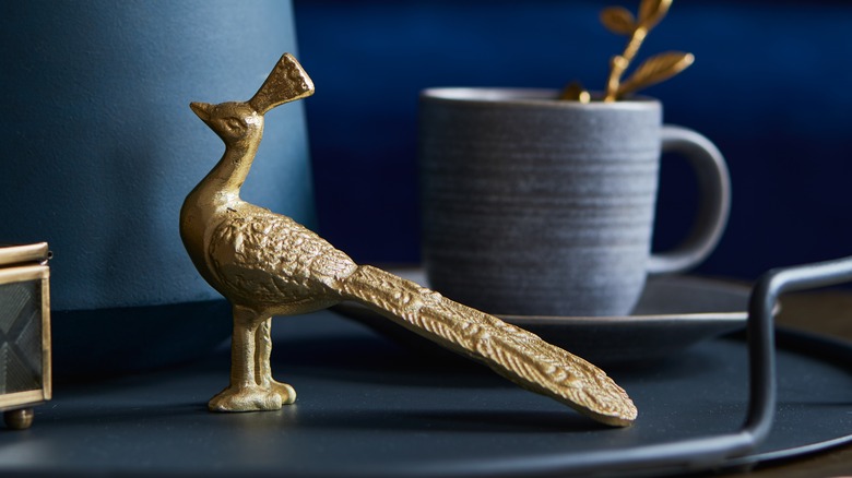 gold peacock on table