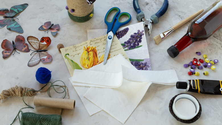 decoupage papers and butterflies on table 