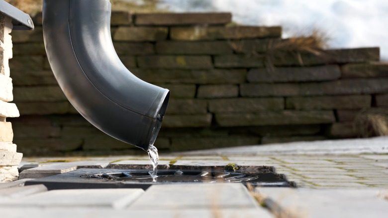 house downspout with water