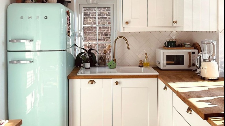 Kitchen with mint green fridge