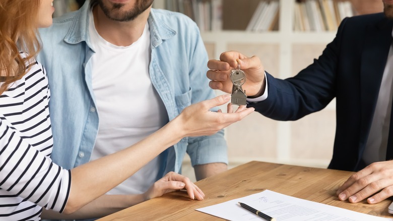 handing over keys to owner