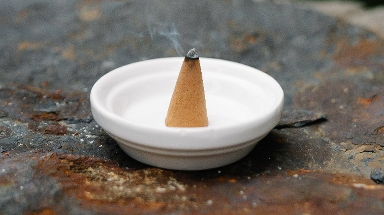 Cone incense in small dish