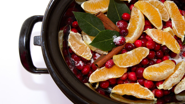 Fruit, cinnamon, berries in slow cooker