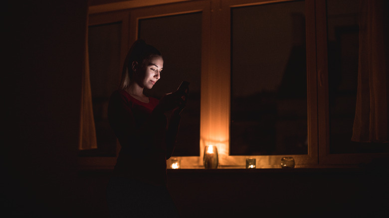 woman in a candlelit room