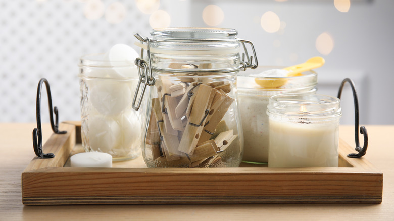 Photo showing clamp lid jar with clothespins and other products in glass jars