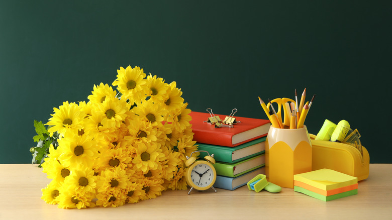 yellow bouquet school books pencils