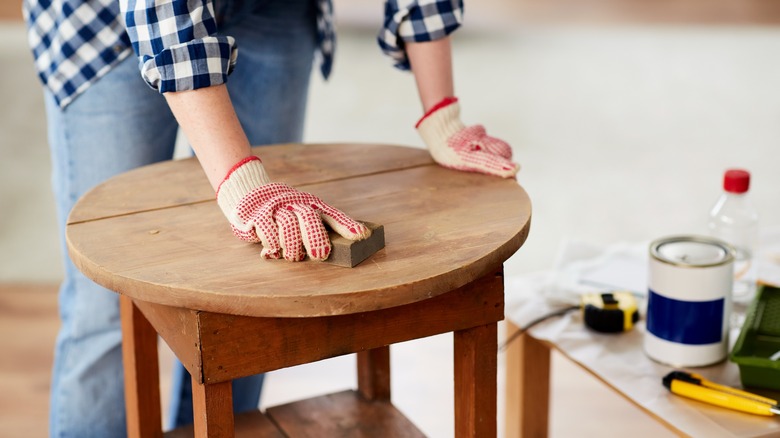 Person sanding table