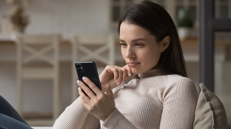 woman checking something on phone