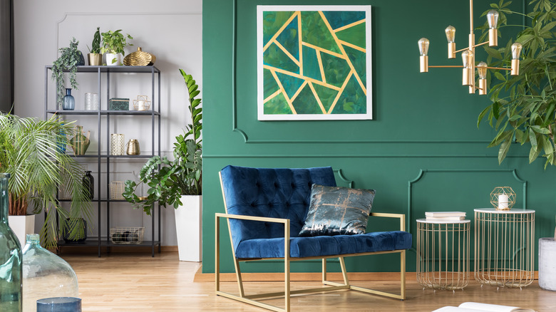 green accent wall with molding