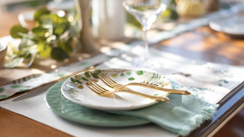 table setting with gold forks