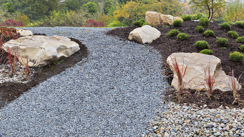 Gravel walkway in a landscaped yard