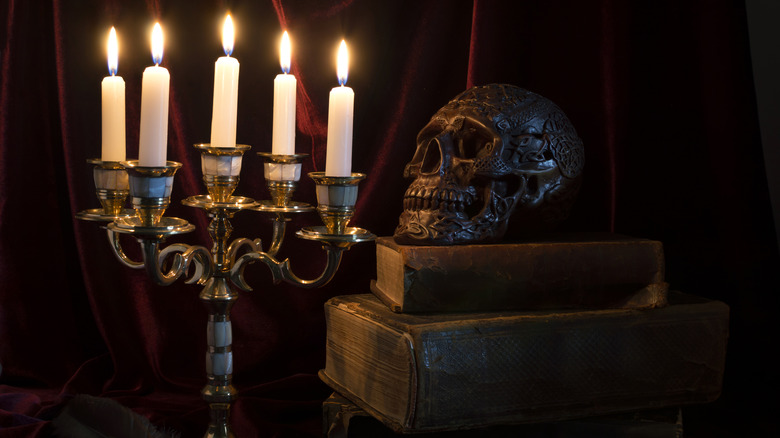 old-fashioned candelabra with skull