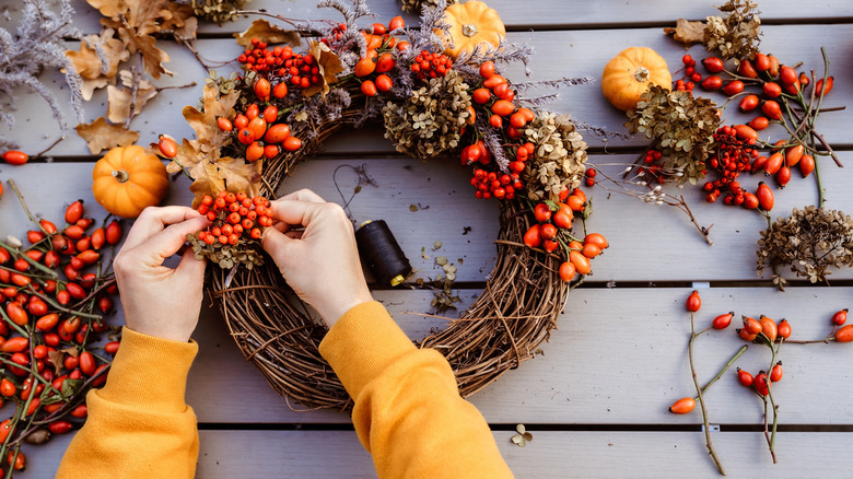 crafting a wreath with berries