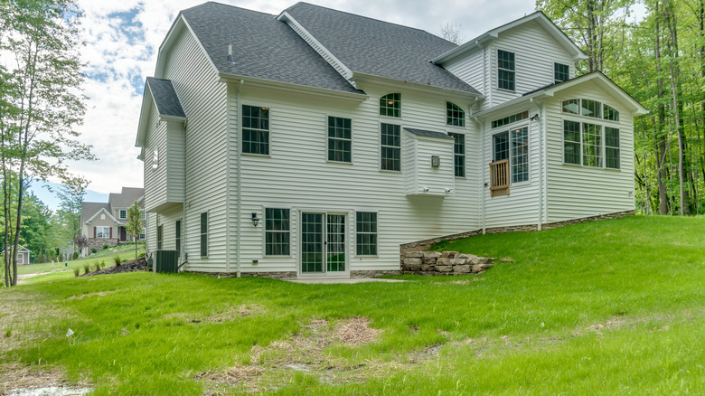 sloped yard with house