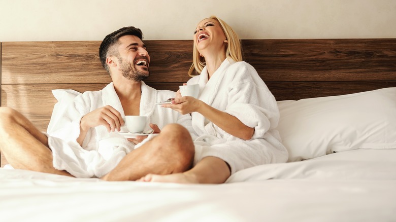 couple laughing with coffee