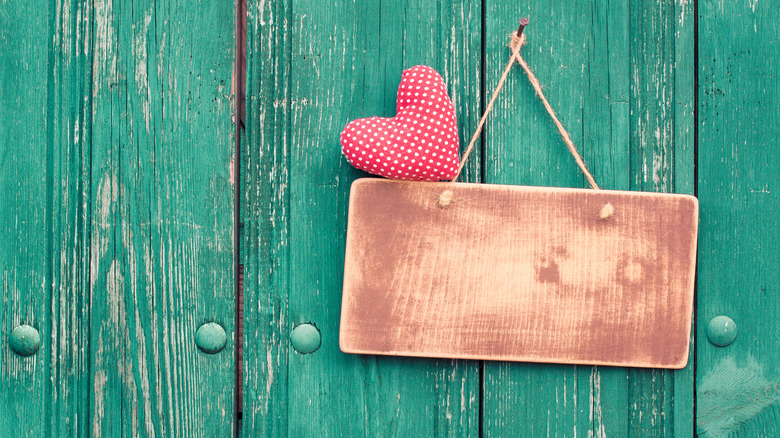 wooden decoration and heart on door