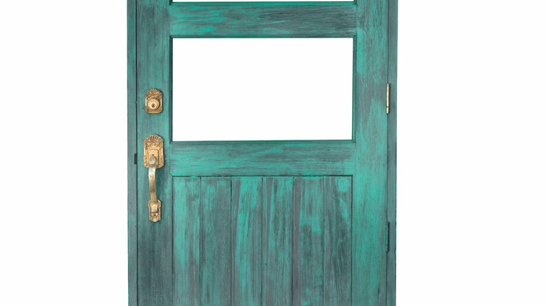 old green door with panel removed