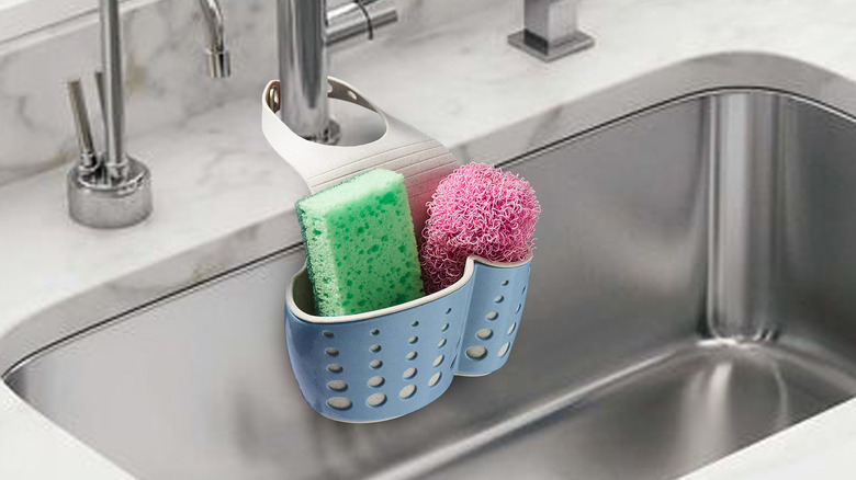 Sponges in caddy on sink