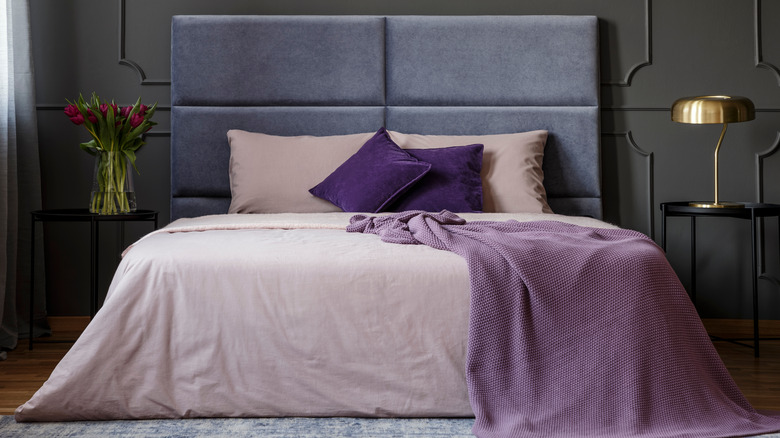 dark mauve bedroom with pillows