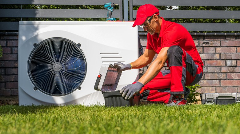 technician working on heat pump 