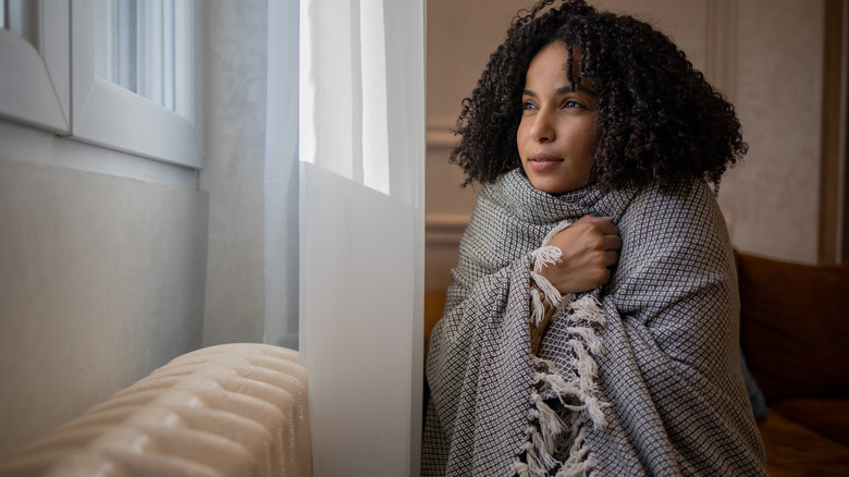 Woman in front of window