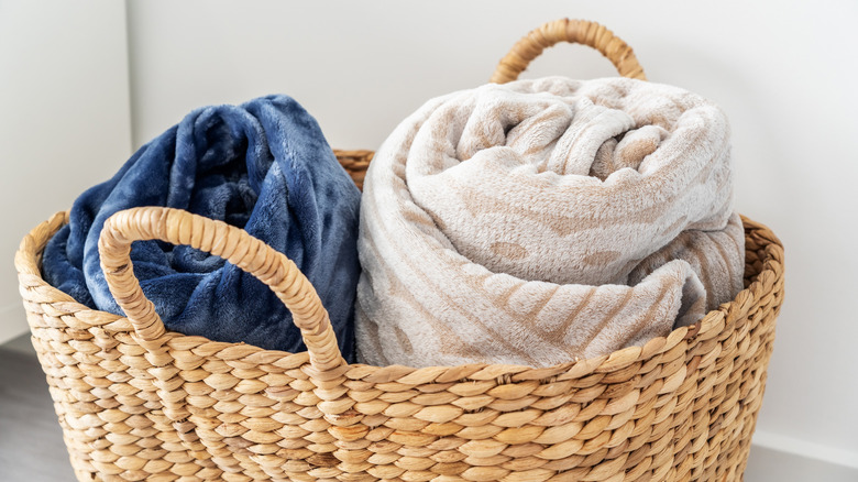 Clean fleece blankets stored in a basket