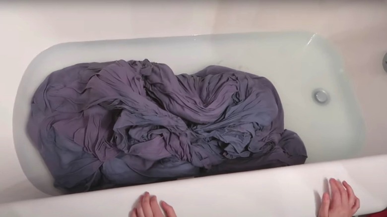Wet grey material in bathtub