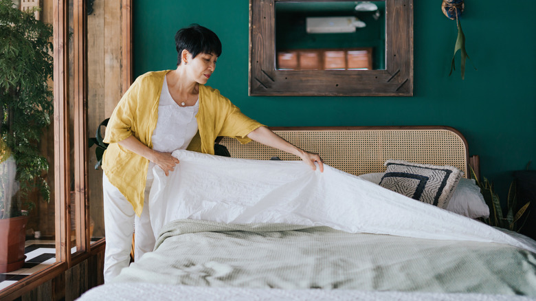 Woman making the bed