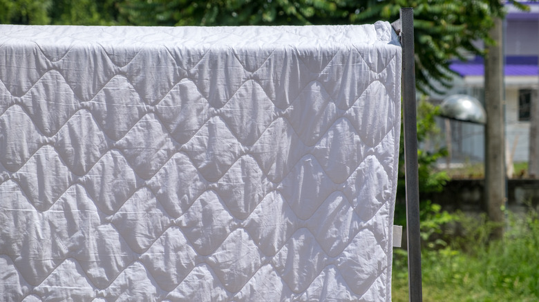 Comforter drying outdoors