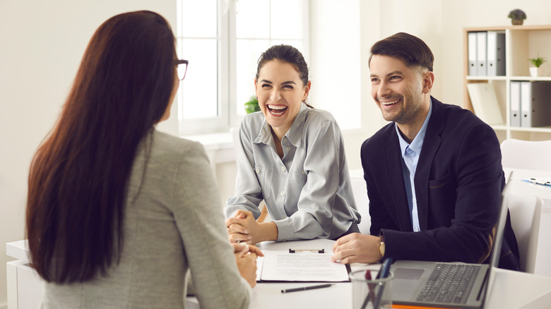 Couple with real estate agent