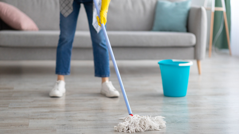 person mopping floor