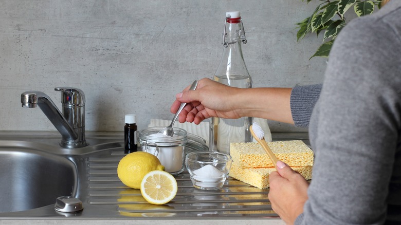 person preparing cleaning solution