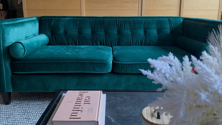 Green tufted velvet sofa