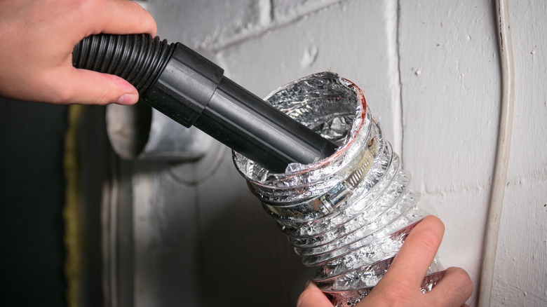 Cleaning dryer vent with vacuum